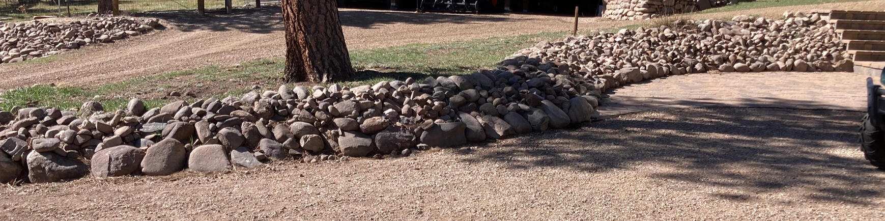 Removed rock, cleaned, new weed barrier, replaced rock